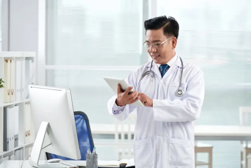 asian_doctor_using_medical_app_his_digital_device_a8fe5008ff.webp