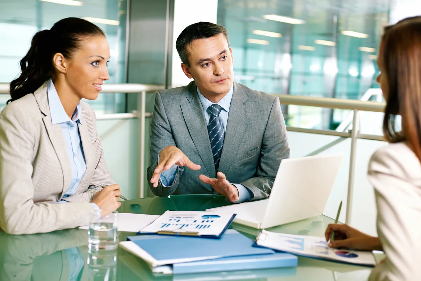 Medical marketing team discussing paid campaign testing strategy in a meeting