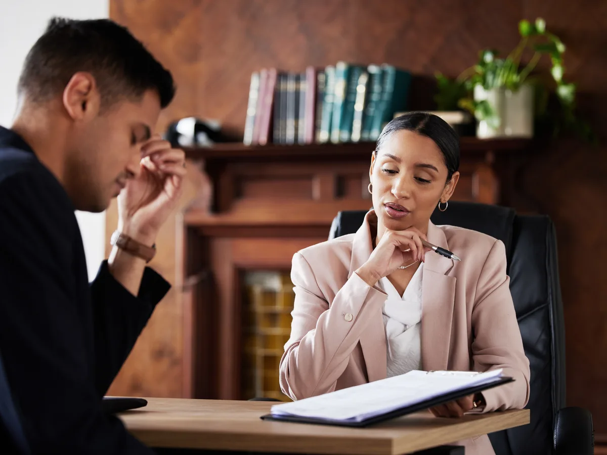 AI chat interface showing a person asking for a law firm recommendation