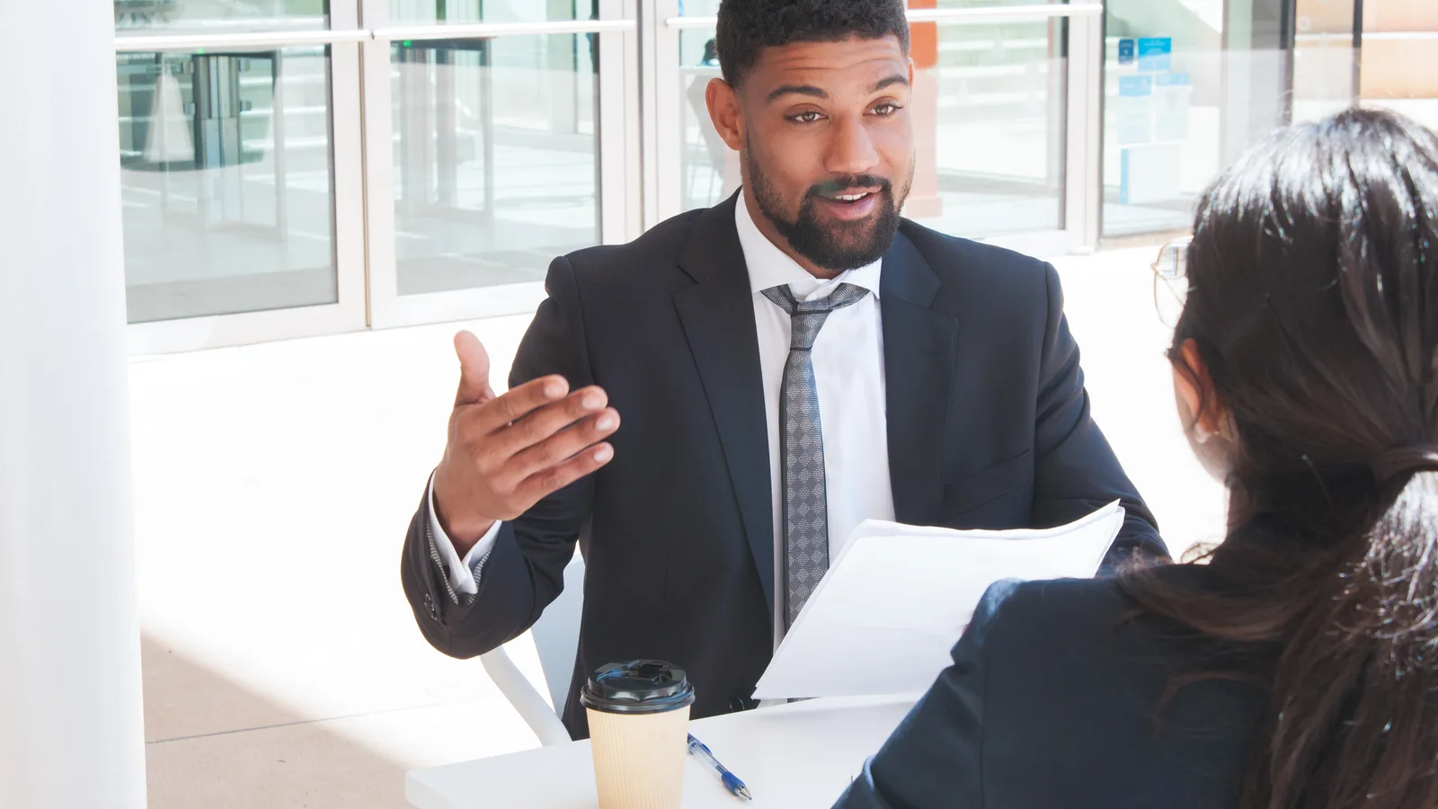 Law firm partner reviewing the firm's website design on a laptop in a modern office