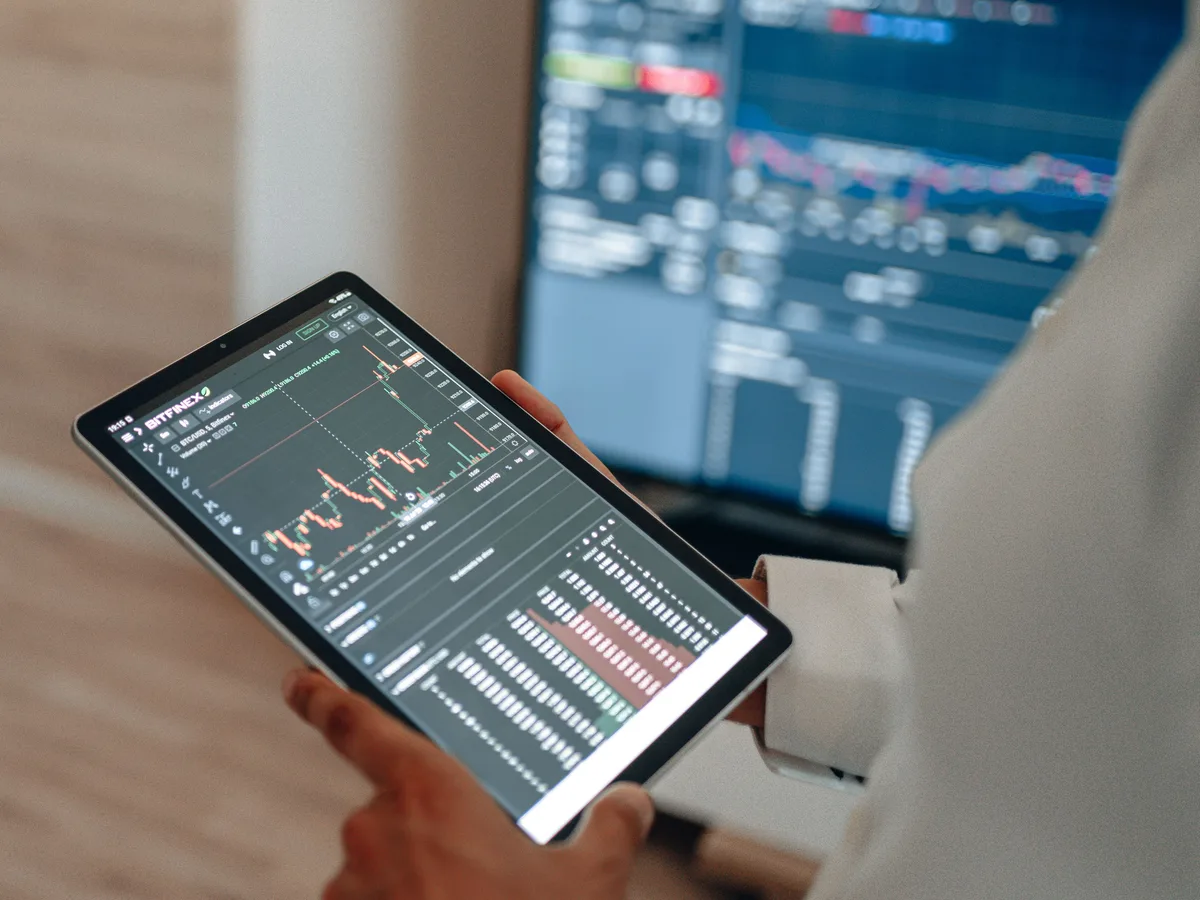 Clinical team reviewing a digital marketing dashboard on a screen