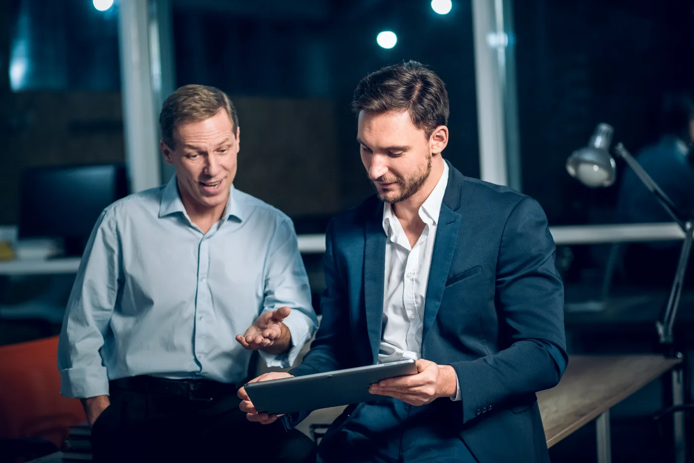 Chiropractor reviewing patient data and marketing analytics on a tablet