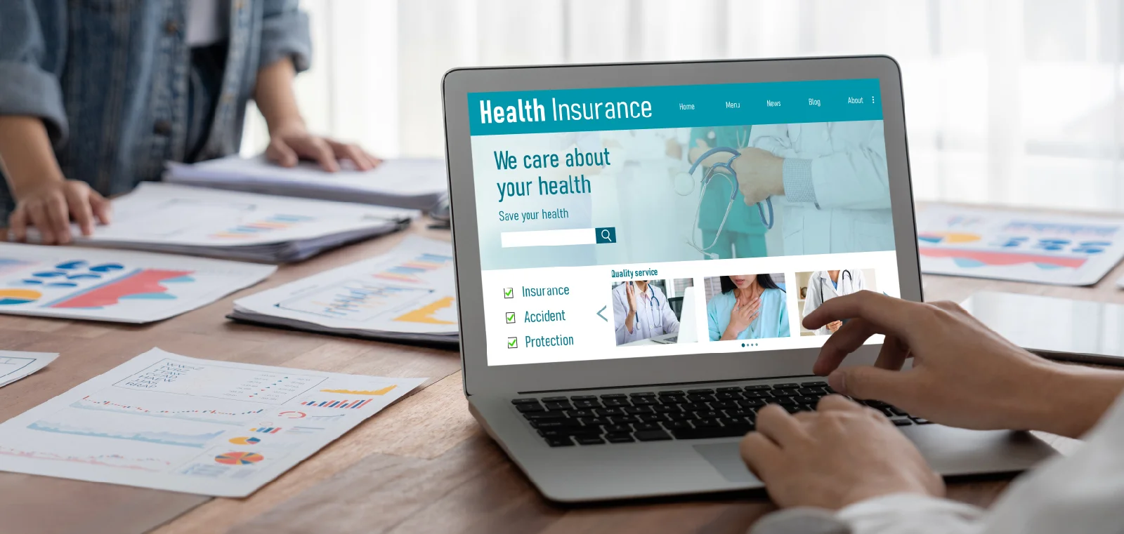 Healthcare professionals in a clinical environment reviewing digital data