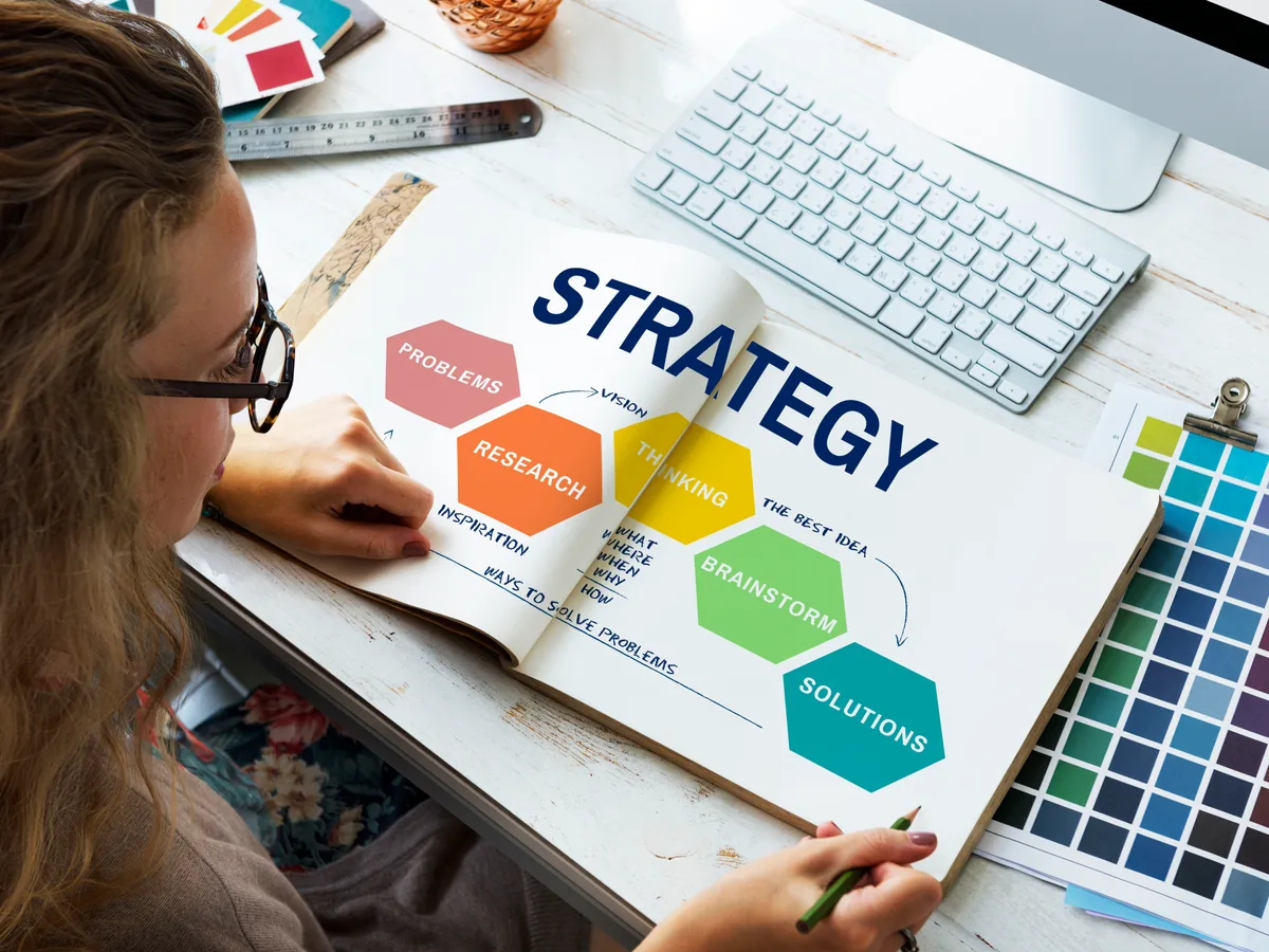 Practice marketing coordinator planning an email segmentation strategy on a laptop