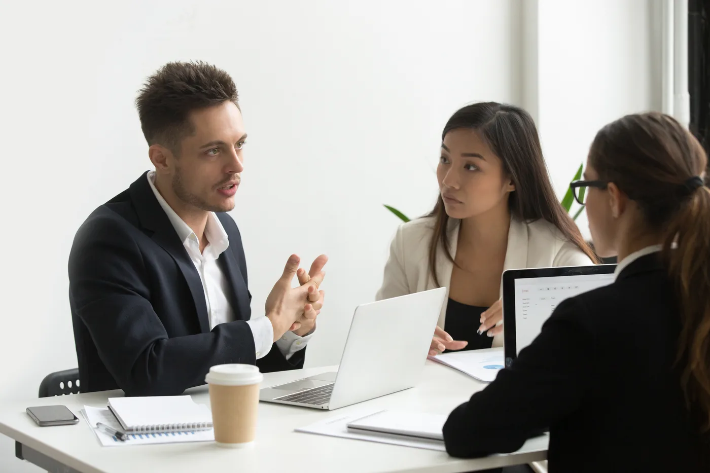 Law firm team discussing digital marketing strategy around a conference table