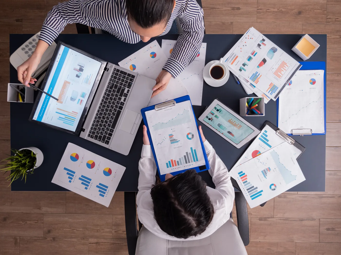 Chiropractor reviewing content marketing analytics on a laptop