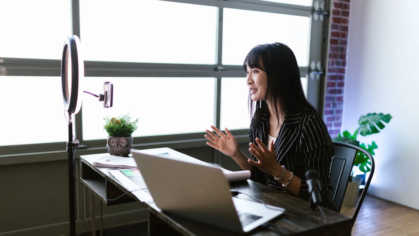 Healthcare marketer reviewing on-page SEO content optimization on a laptop