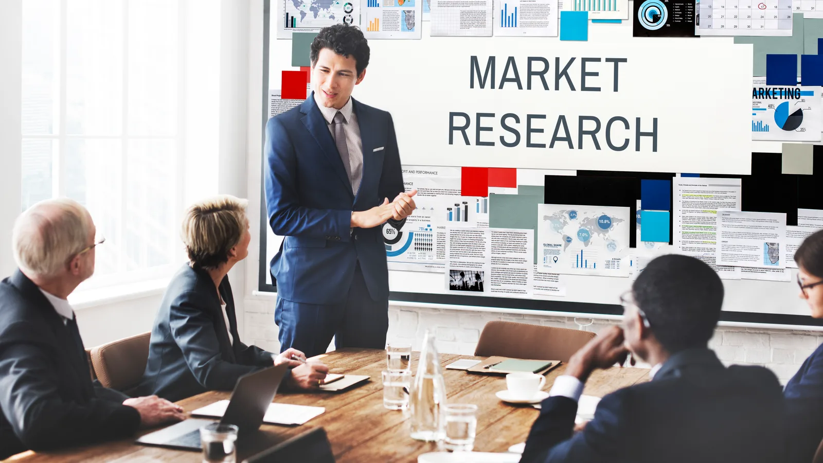 Healthcare practice owner reviewing target market data and marketing budget figures