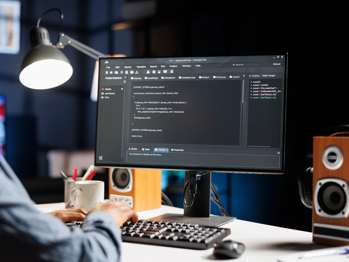 Developer working on a custom WordPress theme and plugin code on screen