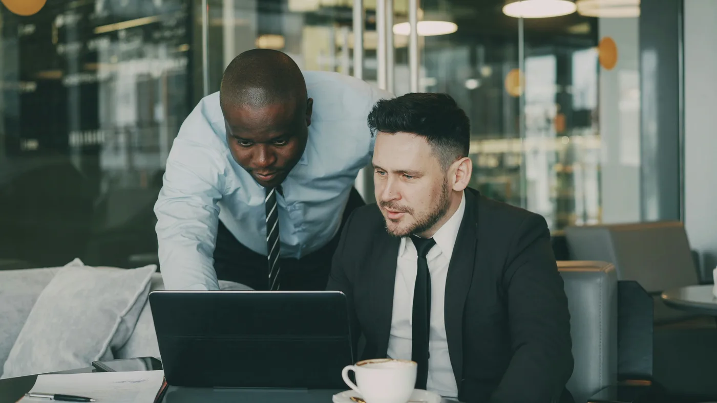 Healthcare professionals in a clinical environment reviewing website and digital data