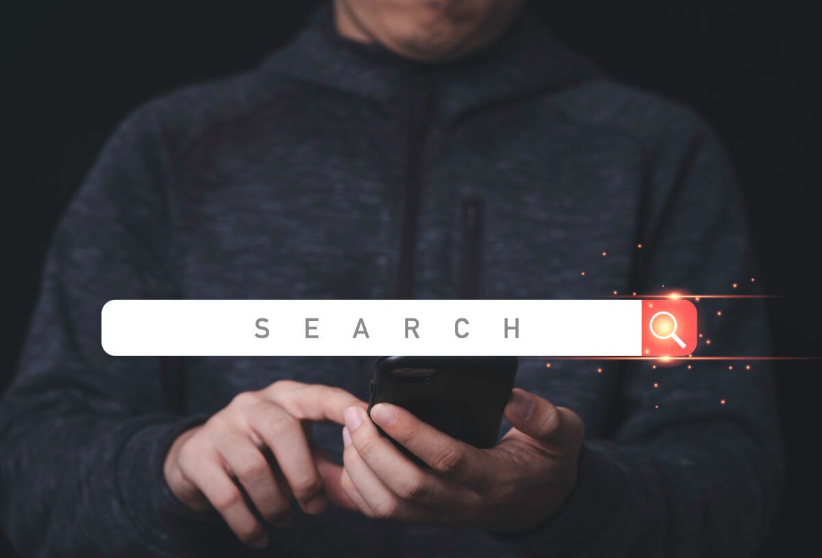 businessman-hand-holding-mobile-phone-digital-design-searching-bar-icon.jpg