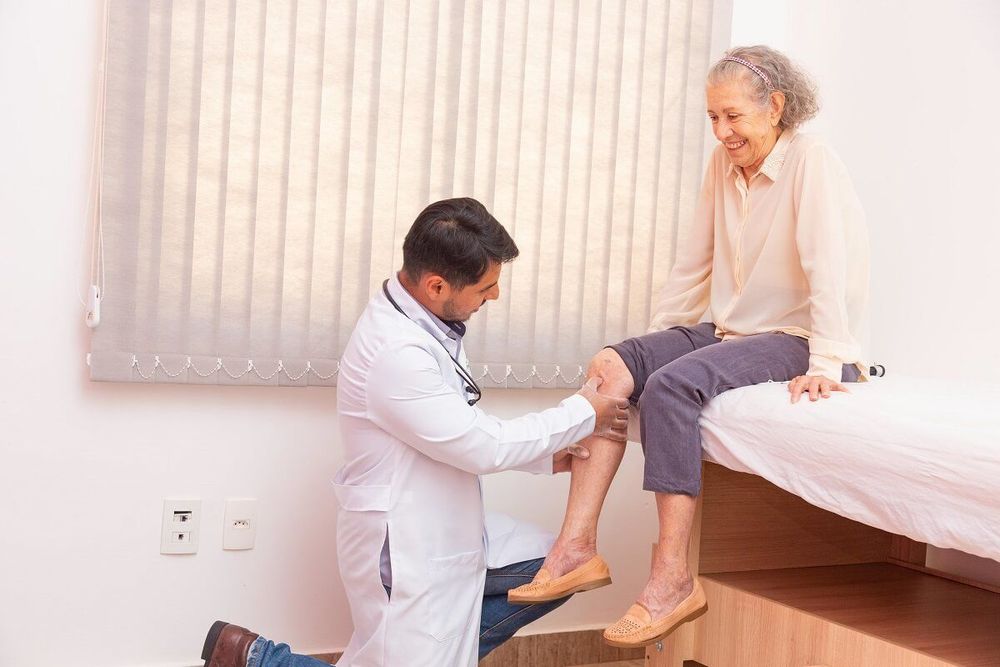 Chiropractor consulting with a patient in a modern practice setting