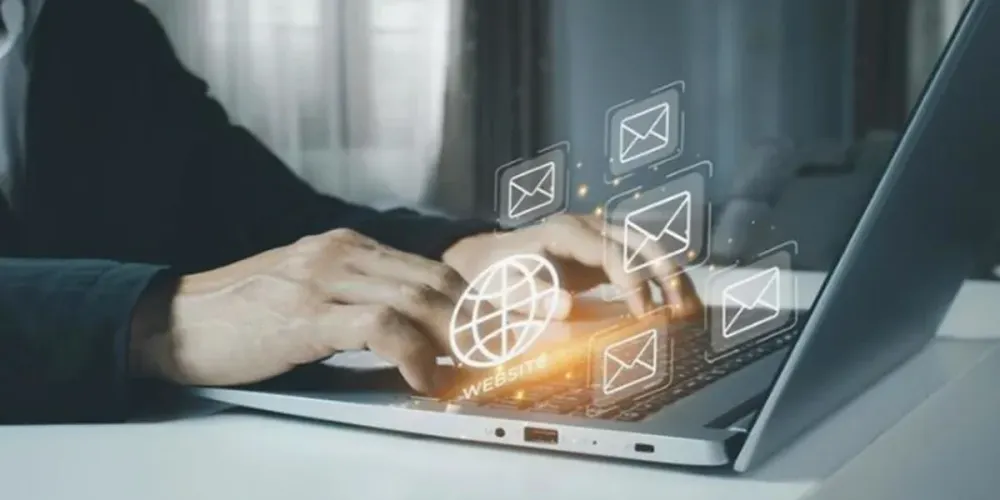 Healthcare marketer reviewing an email campaign and SEO analytics on a laptop