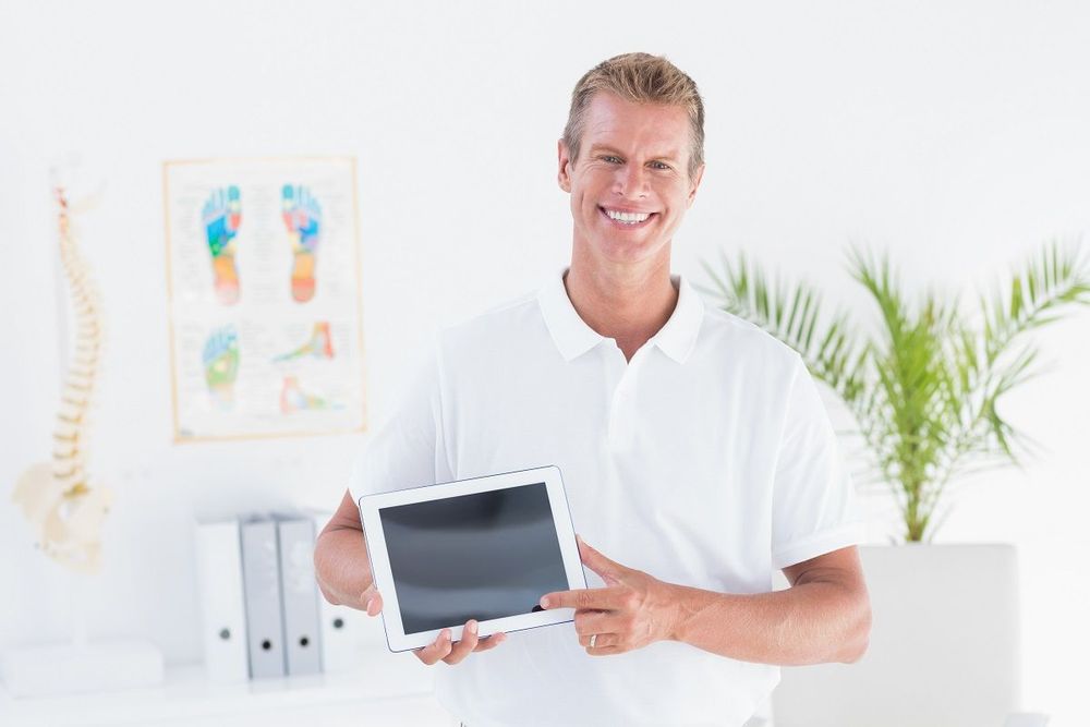 Chiropractic marketing campaign planning session with analytics data